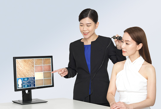NYSS consultant performing a skin analysis on a client